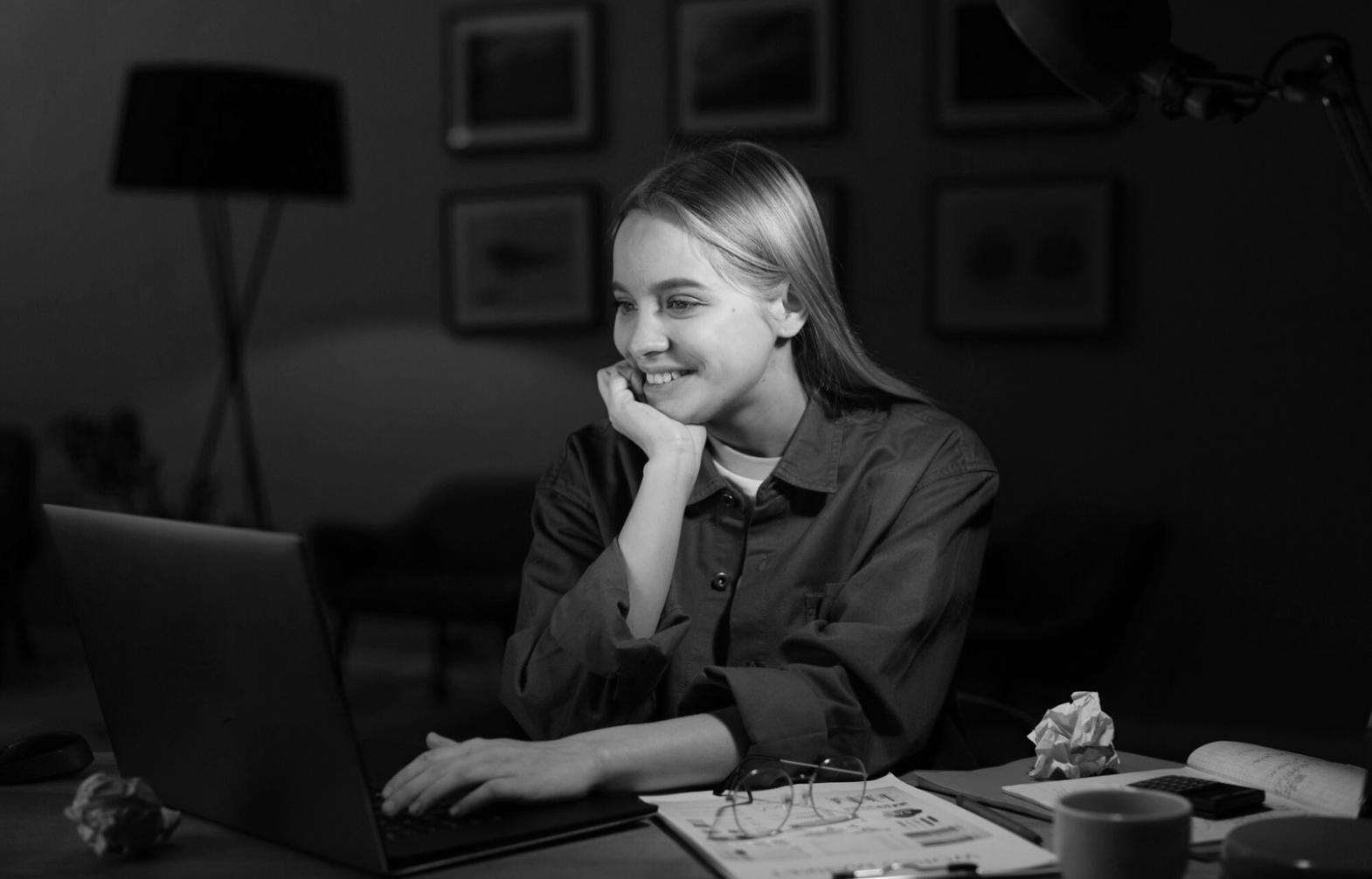 Student working through budget scenarios on laptop